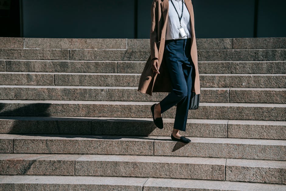 businesswoman walking in city in summer