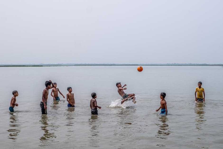 children playing on serene river beach