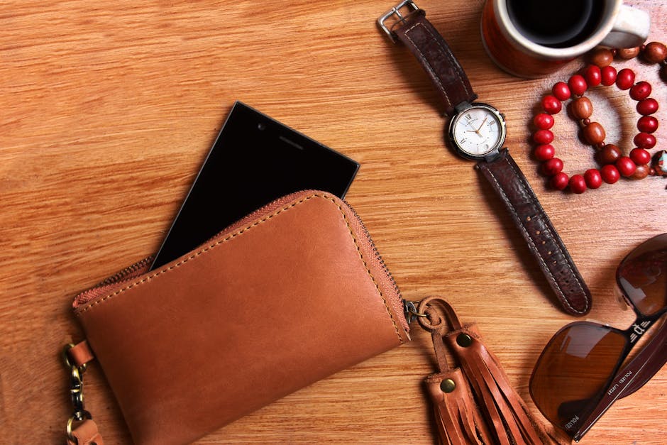 close up of classic leather handbag and watch