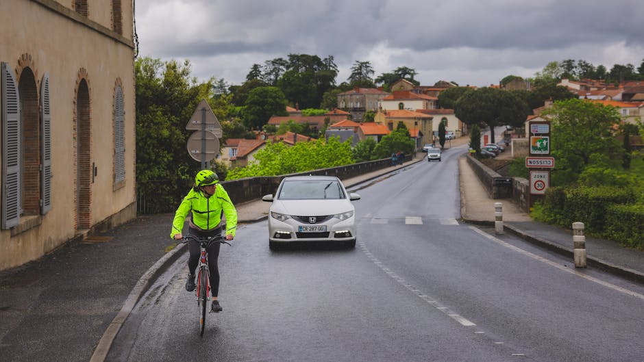 couple cycling through a beautiful French village