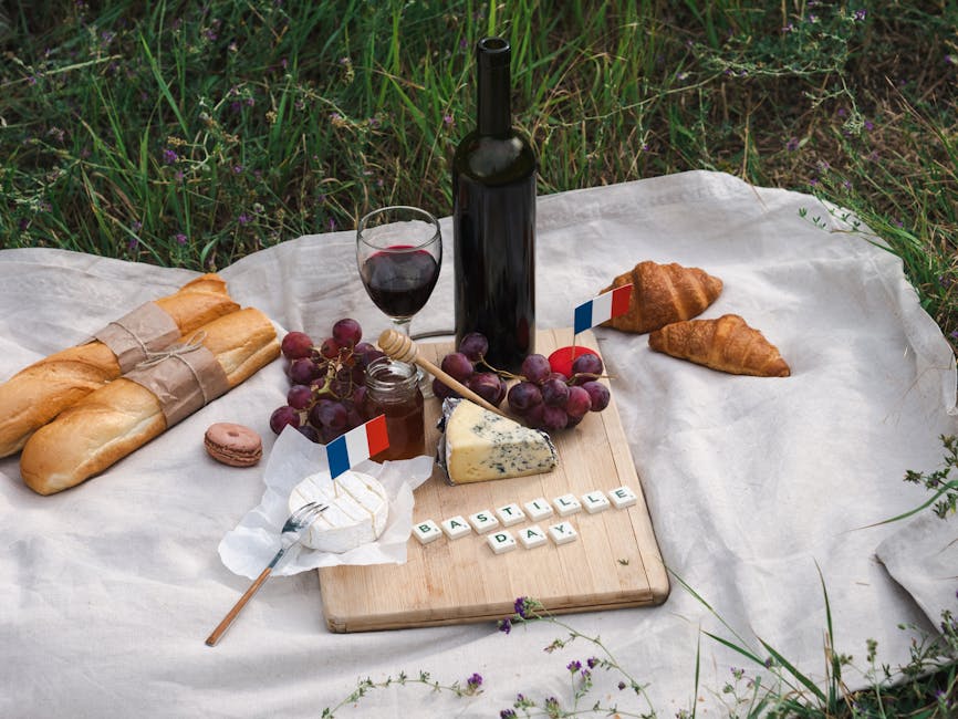 couple enjoying picnic with baguette and cheese by river