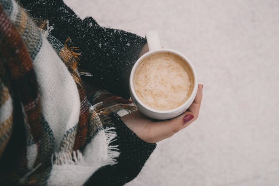 cozy winter fashion woman drinking coffee