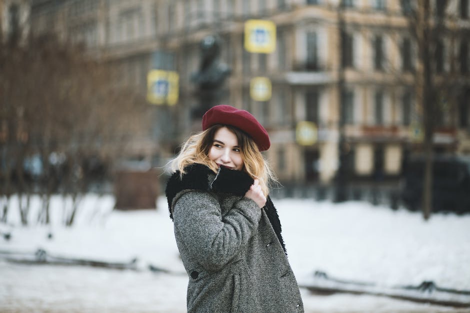 french woman in coat smiling