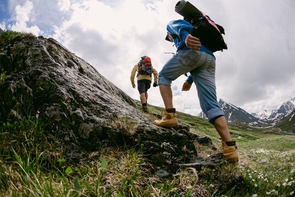 hiking boots and backpack in mountains