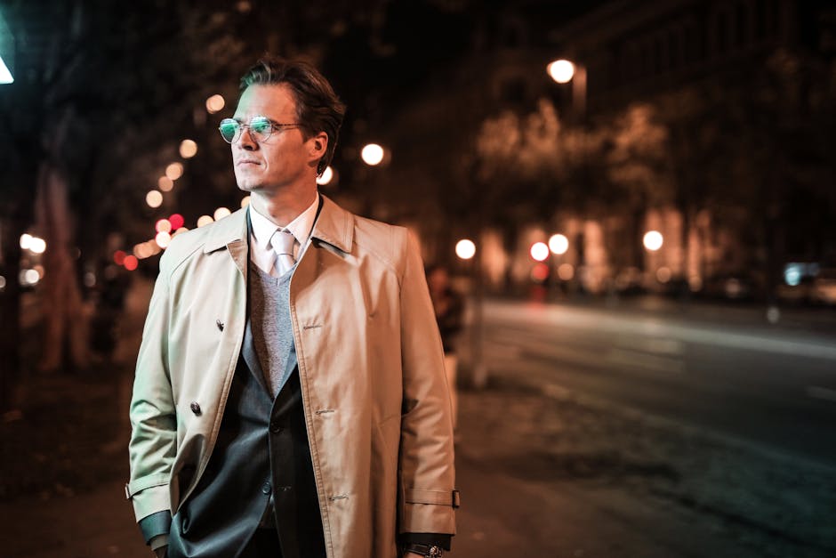 man in stylish trench coat walking in Paris