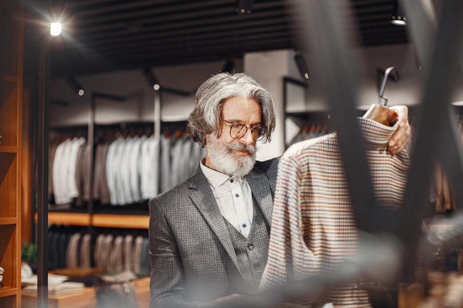 man trying on jacket in shop