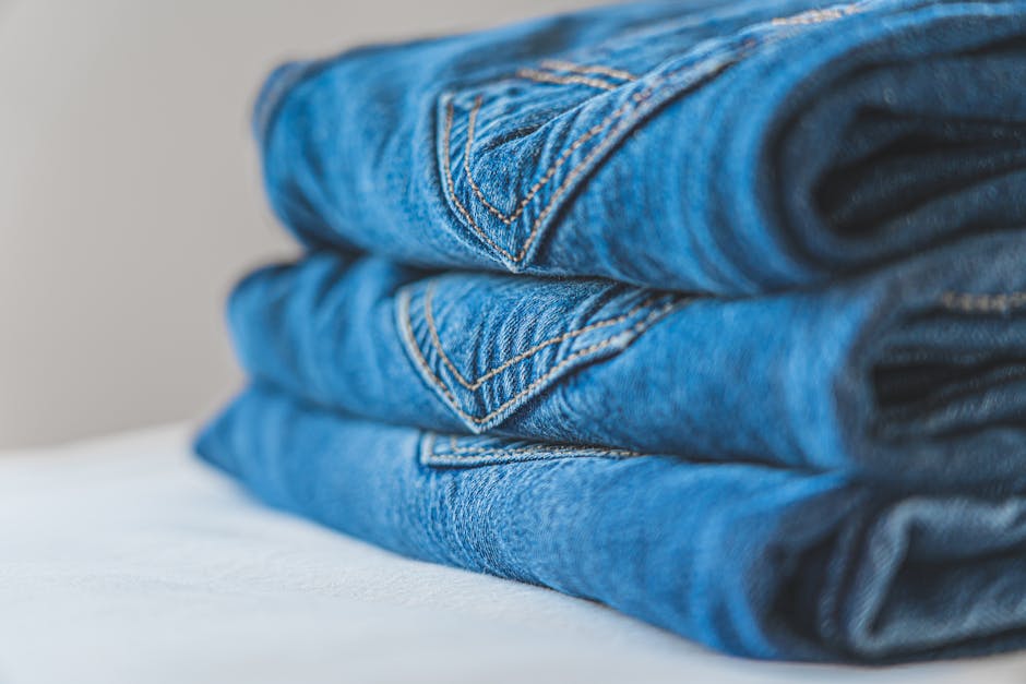 minimalist men's wardrobe with neatly folded clothes