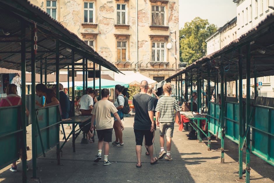 People browsing vintage clothing market in Poland
