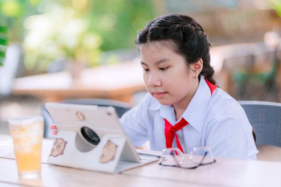 person studying with tablet
