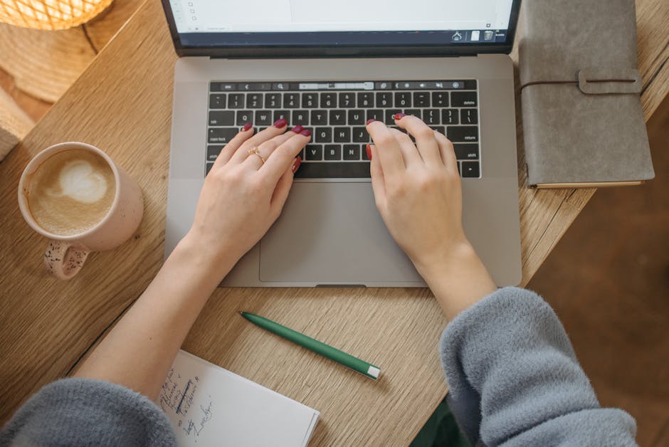 person using AI writing assistant on laptop with coffee