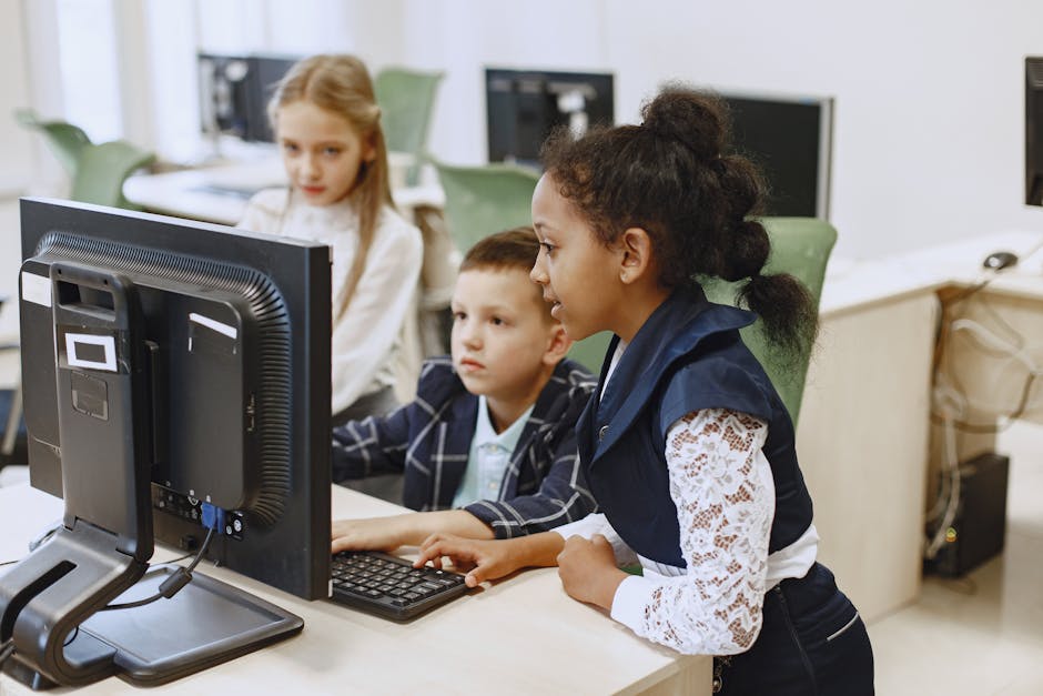 students collaborating on a project with computers