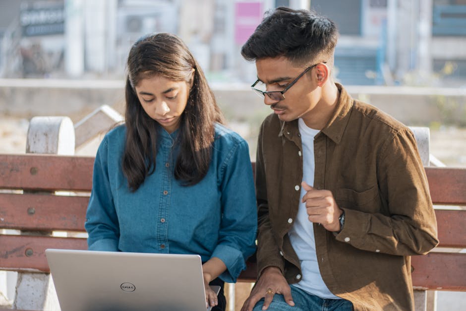students working on laptop