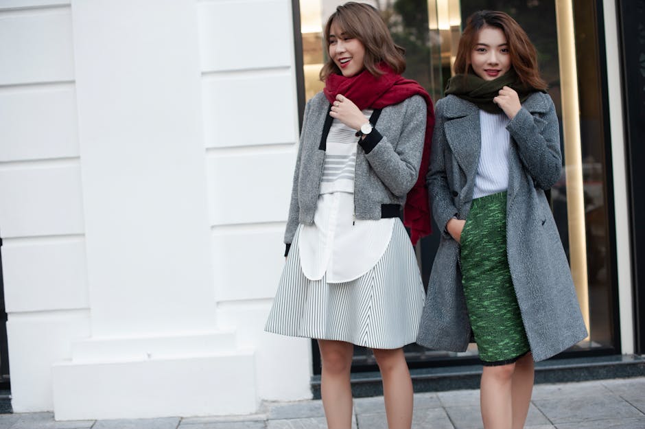 table of seasonal french clothes with linen dress and wool coat