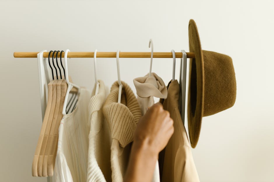 woman arranging clothes in a capsule wardrobe