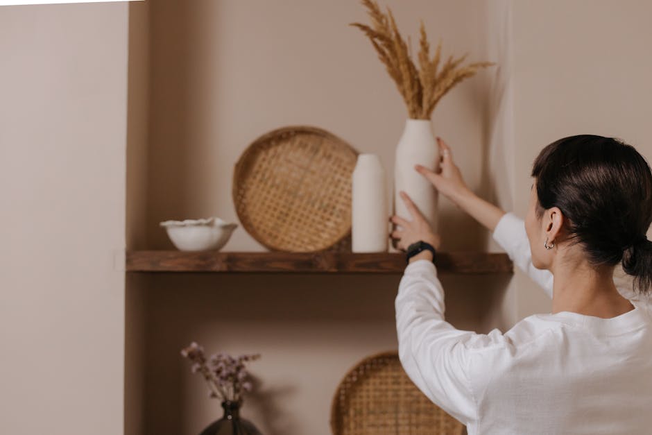 woman arranging scarves and jewelry on a shelf