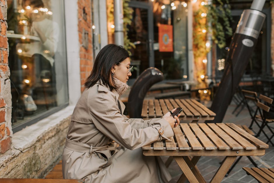 woman in cafe with trench coat
