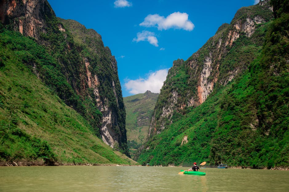 woman kayaking on clear river in brazil