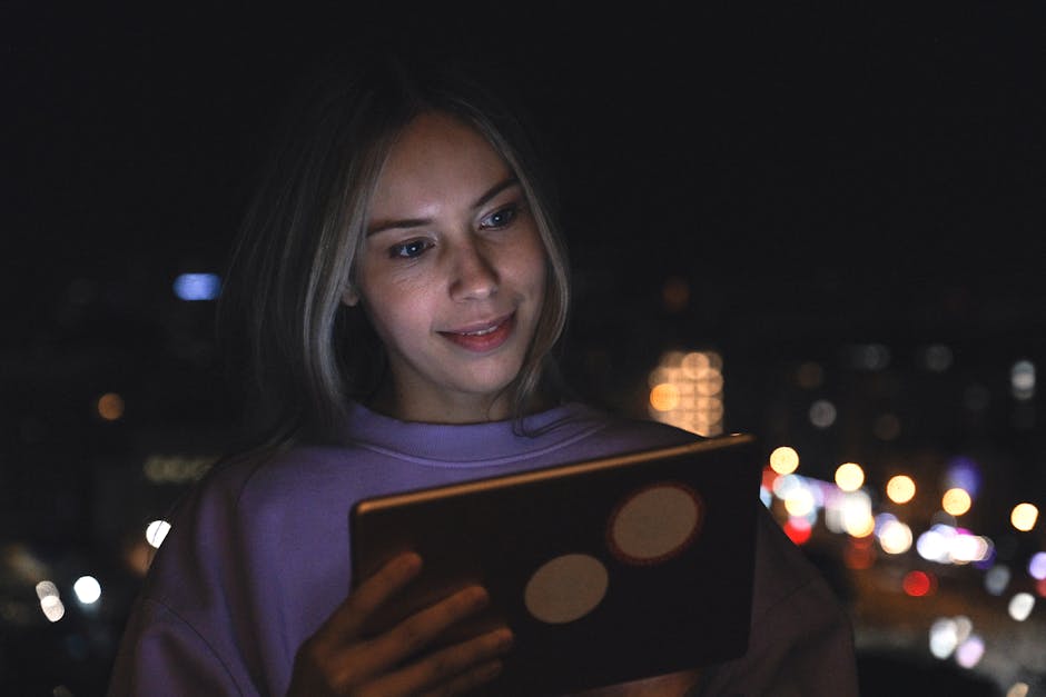 woman looking at screen thoughtfully