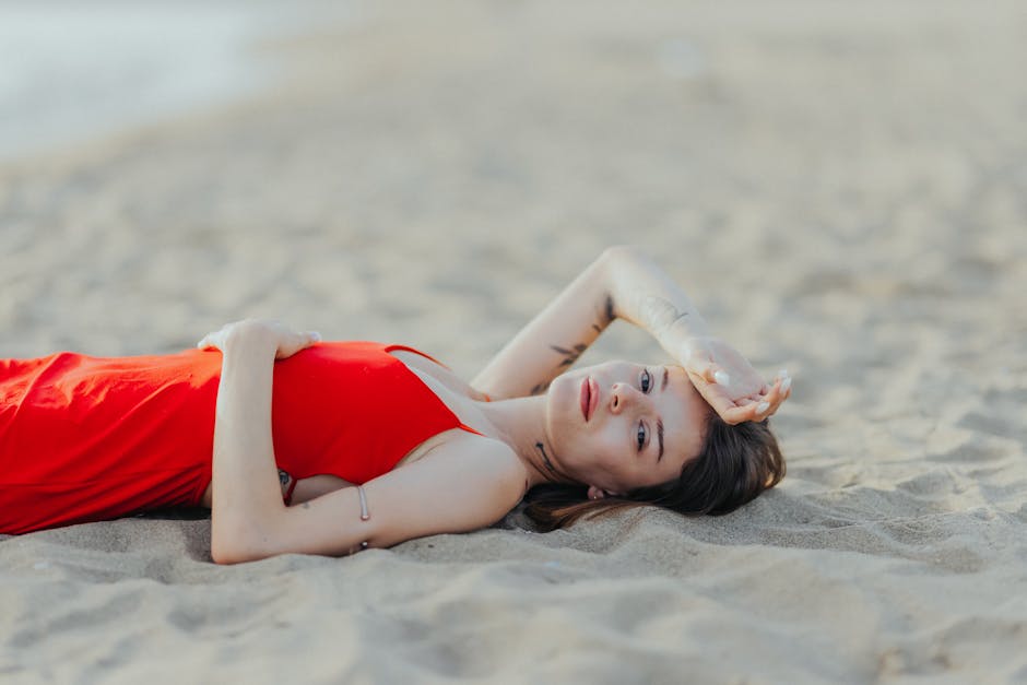 woman relaxing on beach in linen dress