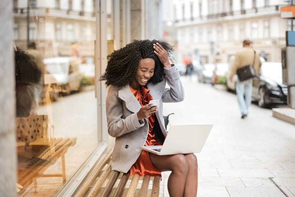 woman smiling at laptop