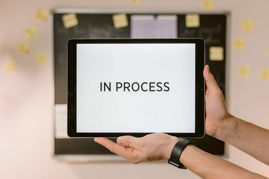 woman using a tablet to manage tasks on a green background