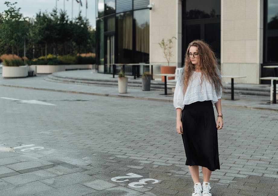 woman wearing elegant culottes and blouse in city