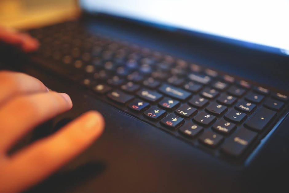 woman writing on laptop with futuristic interface