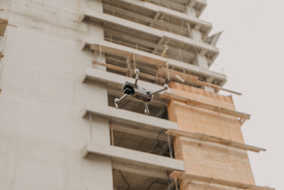 Construction site with drone flying overhead