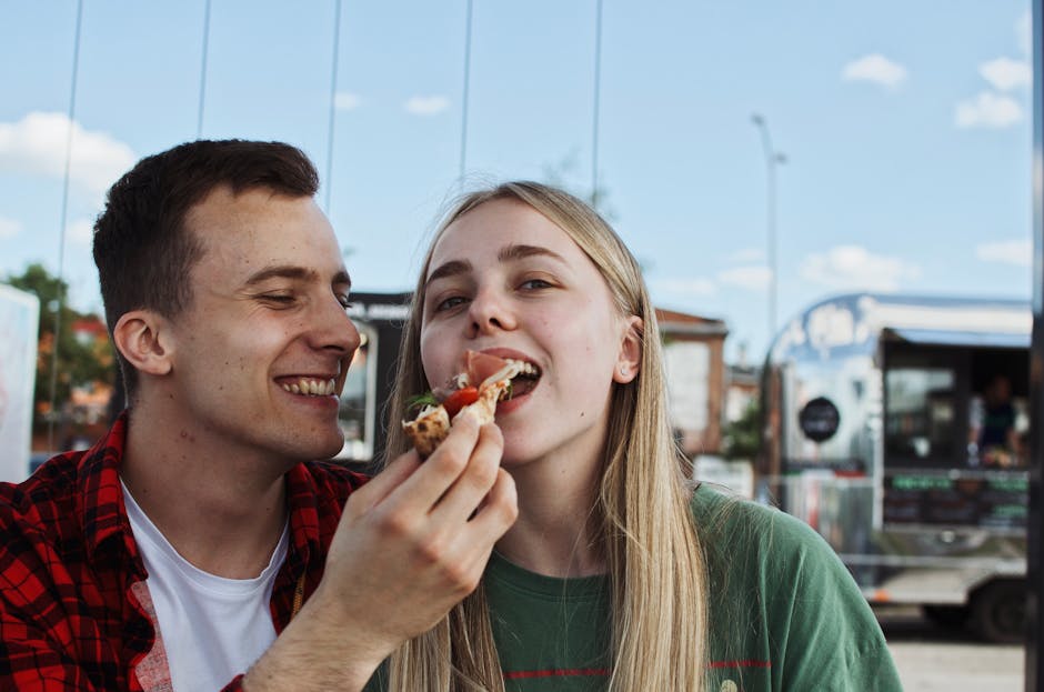 couple eating street food europe