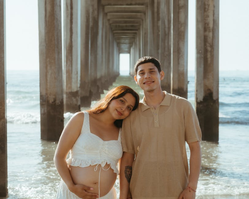 couple laughing beach pier