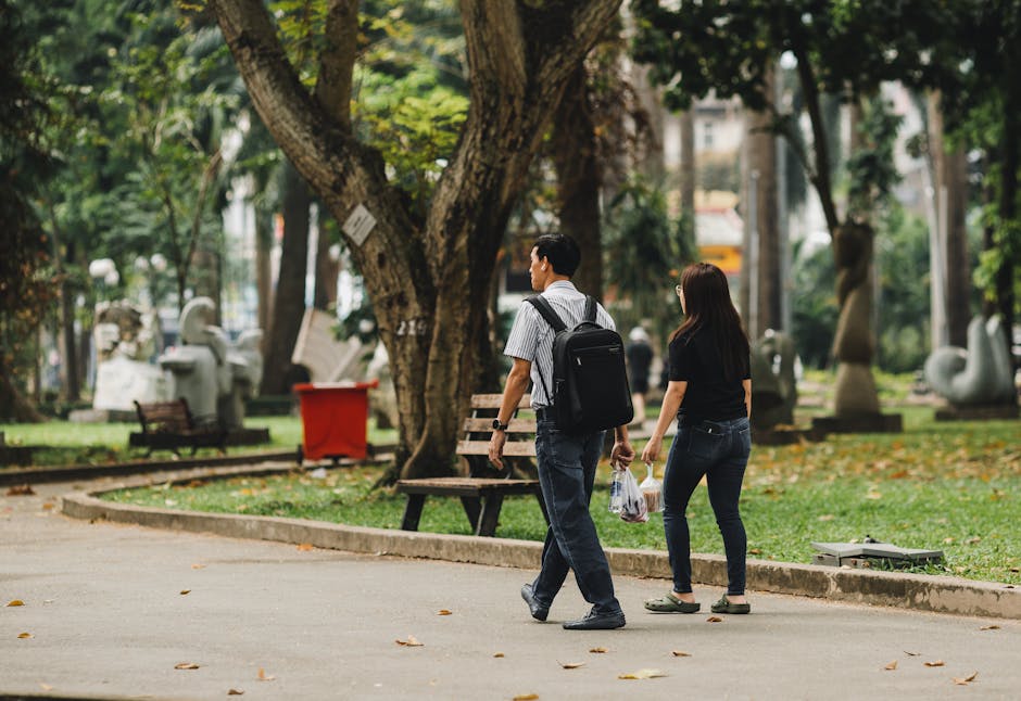 Couple walking city park