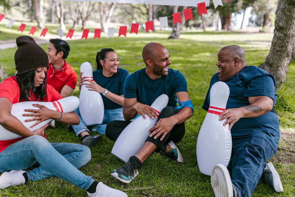 diverse group of people relaxing and laughing in a park