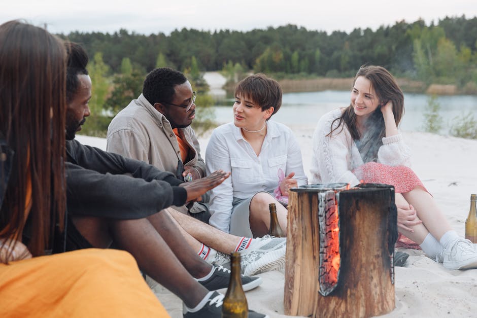 friends enjoying bonfire lakeside