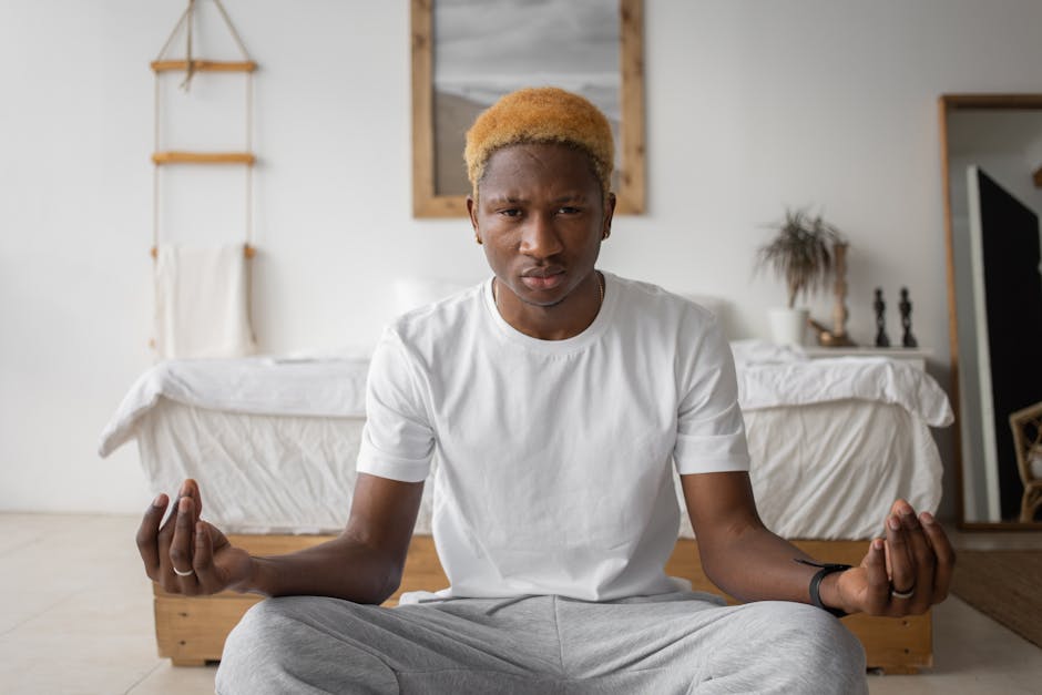 Man meditating in modern home