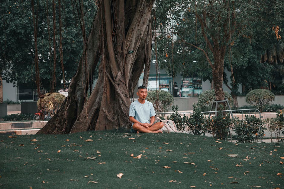 Man meditating in peaceful park