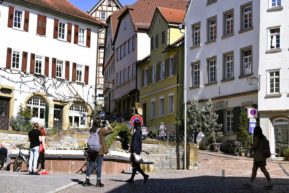 old town street with people walking