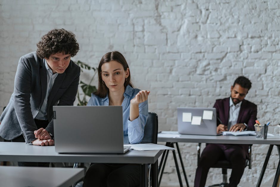 people collaborating with AI assistant in modern office