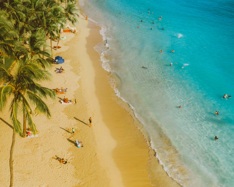 People relaxing on sandy beach