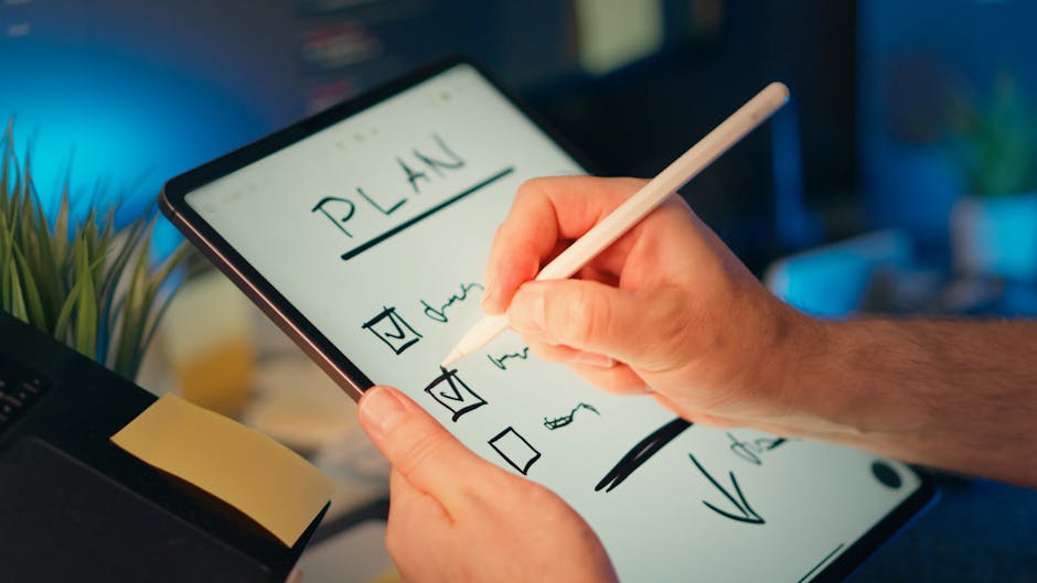 person comparing paper list to tablet