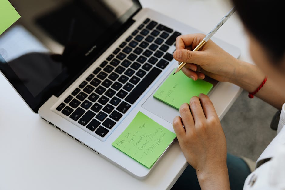 person delegating tasks on laptop
