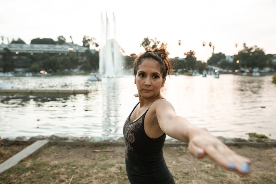 person doing yoga in park