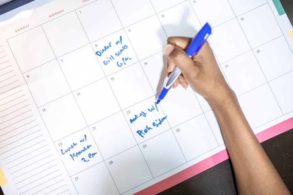 person organizing daily tasks calendar