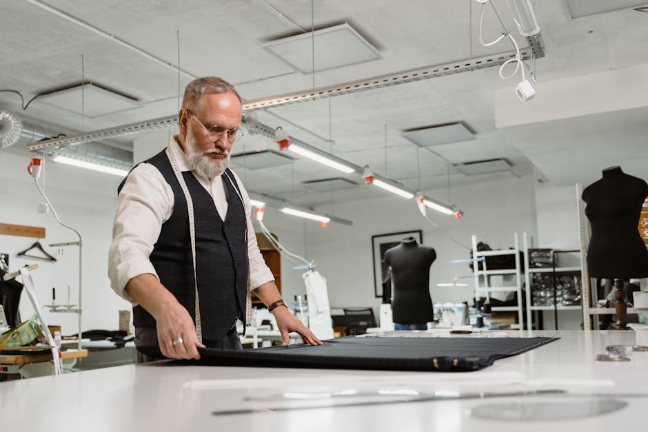 skilled tailor working on garment