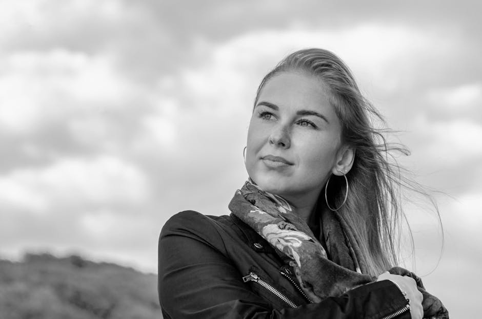 Stylish Ukrainian woman wearing trendy scarf and earrings