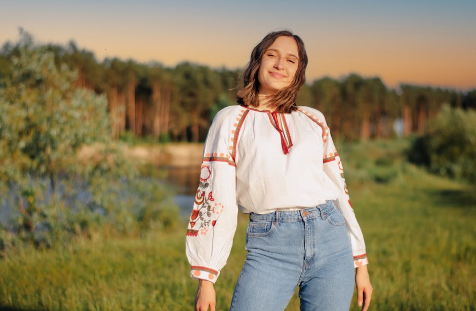 Stylish woman wearing modern vyshyvanka in urban setting