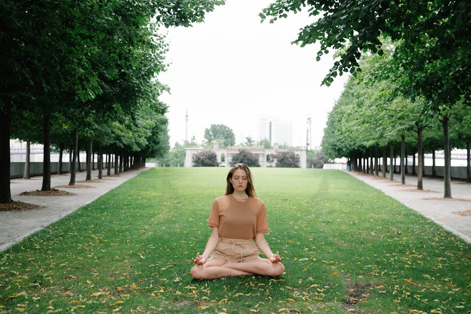 woman meditating in park