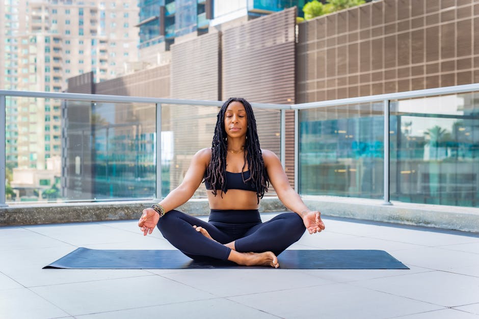 Woman meditating urban balcony