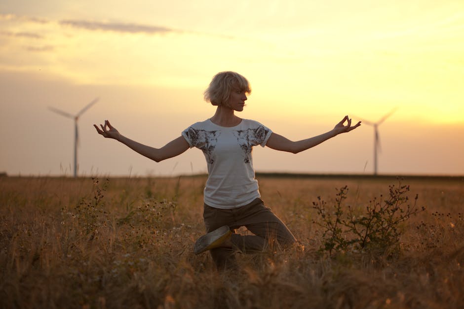 Woman practicing yoga in a sunny Ukrainian field