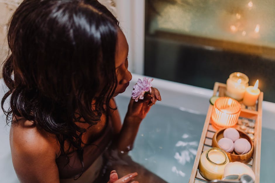 woman relaxing bathtub candles