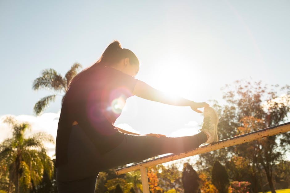 woman stretching in morning sunlight